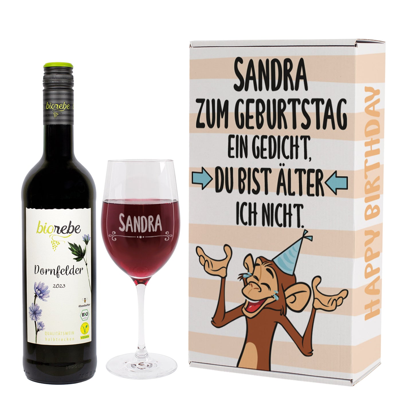 Produktaufnahme des Geschenksets: Biorebe Dornfelder Rotwein, graviertes Weinglas mit Name Sandra und Geschenkbox mit Affenmotiv und Geburtstagsspruch.