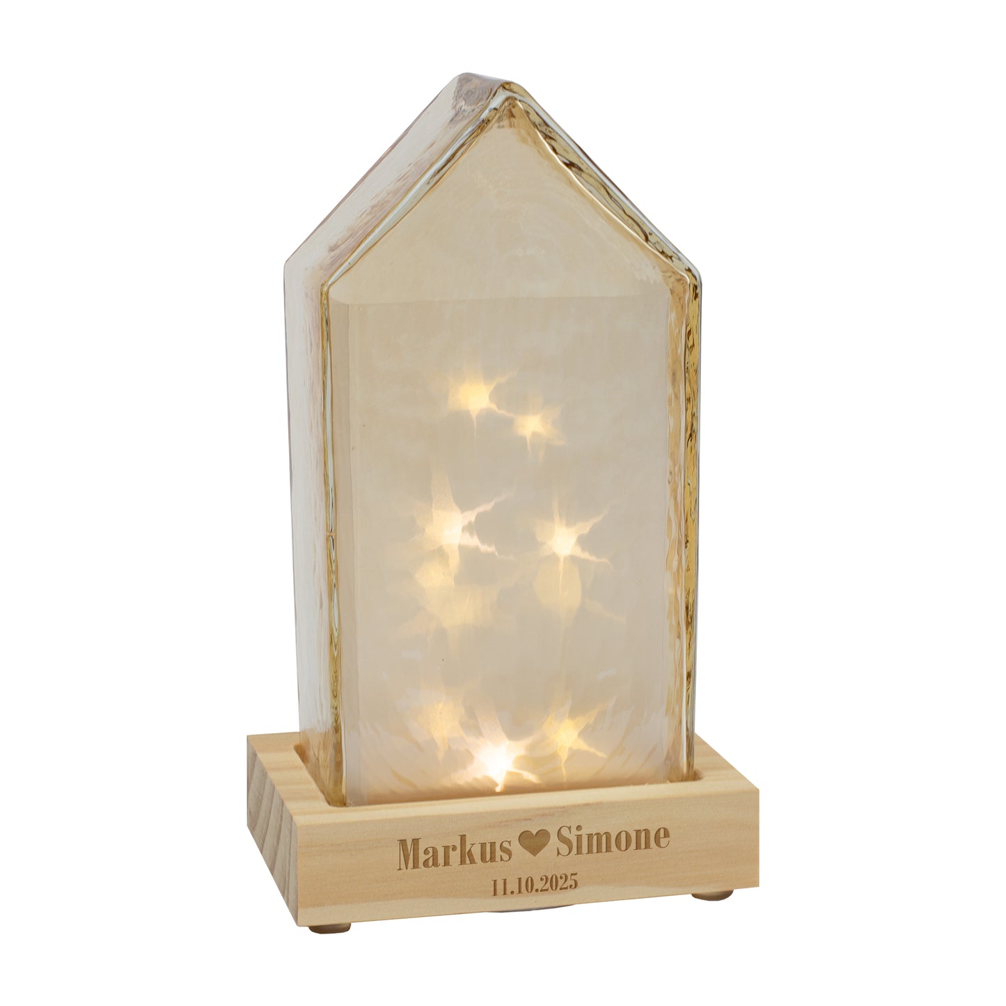 Freigestelltes Leonardo LED-Dekohaus in Amberfarbe mit personalisiertem Holzsockel und warmem Lichtschein.