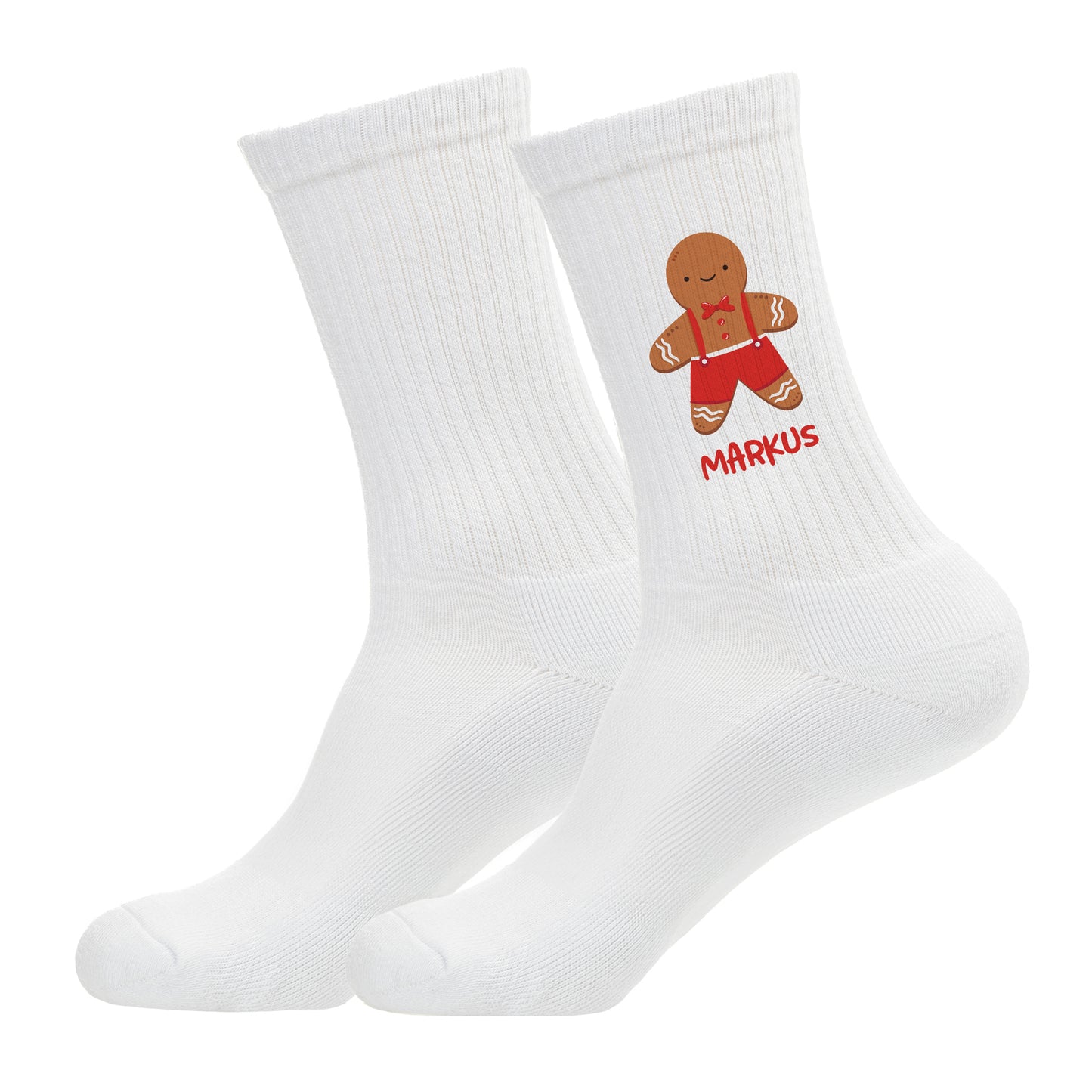 Freigestellte Socken mit Lebkuchenmann und rotem Namensaufdruck.