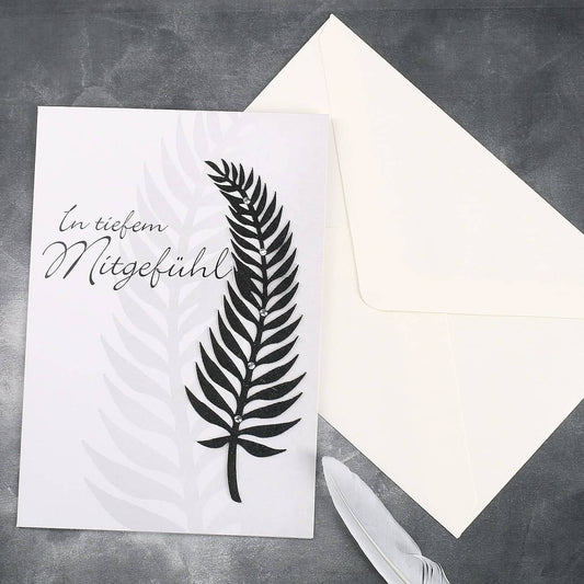 Trauerkarte mit schwarzer Feder