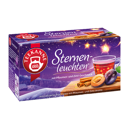 Freigestellte Teepackung „Teekanne Sternenleuchten“ im lila Winterdesign mit Pflaume und Zimt.