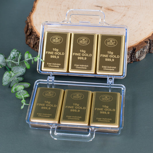 Geöffneter Gold Koffer mit 12 einzeln verpackten Schokoladentafeln