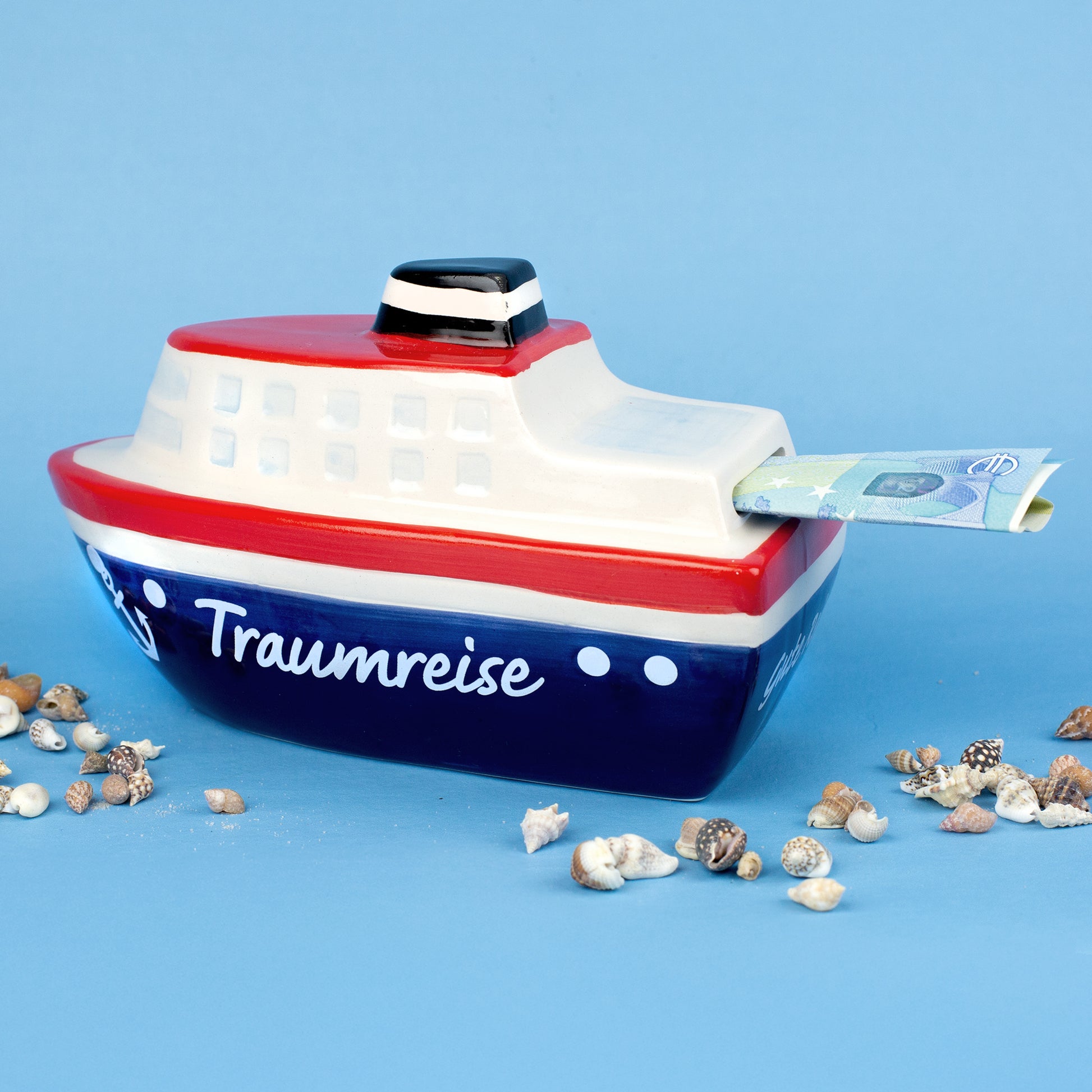 Rückseite der Spardose Schiff Traumreise mit eingestecktem Geldschein