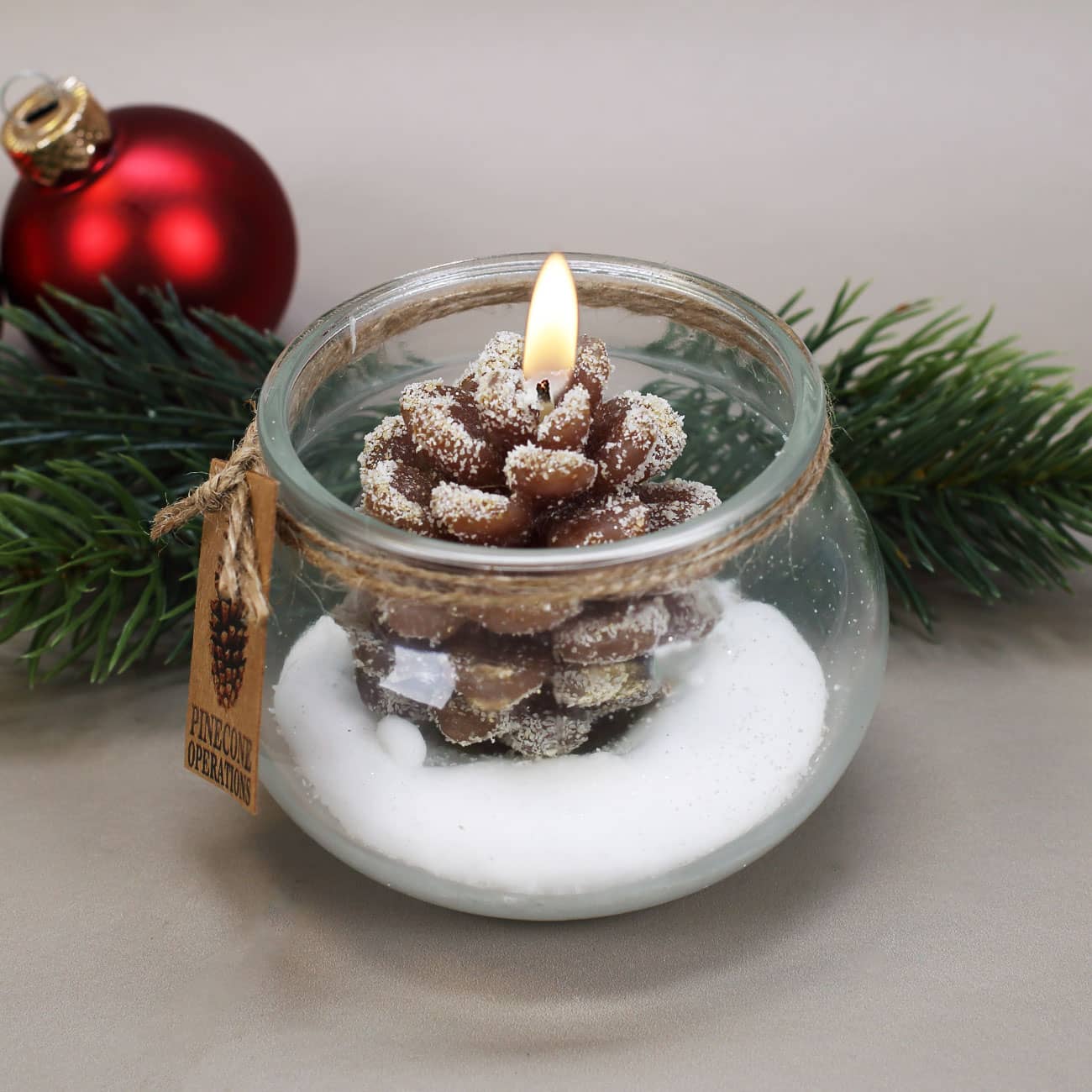Kerze Tannenzapfen im Glas braun