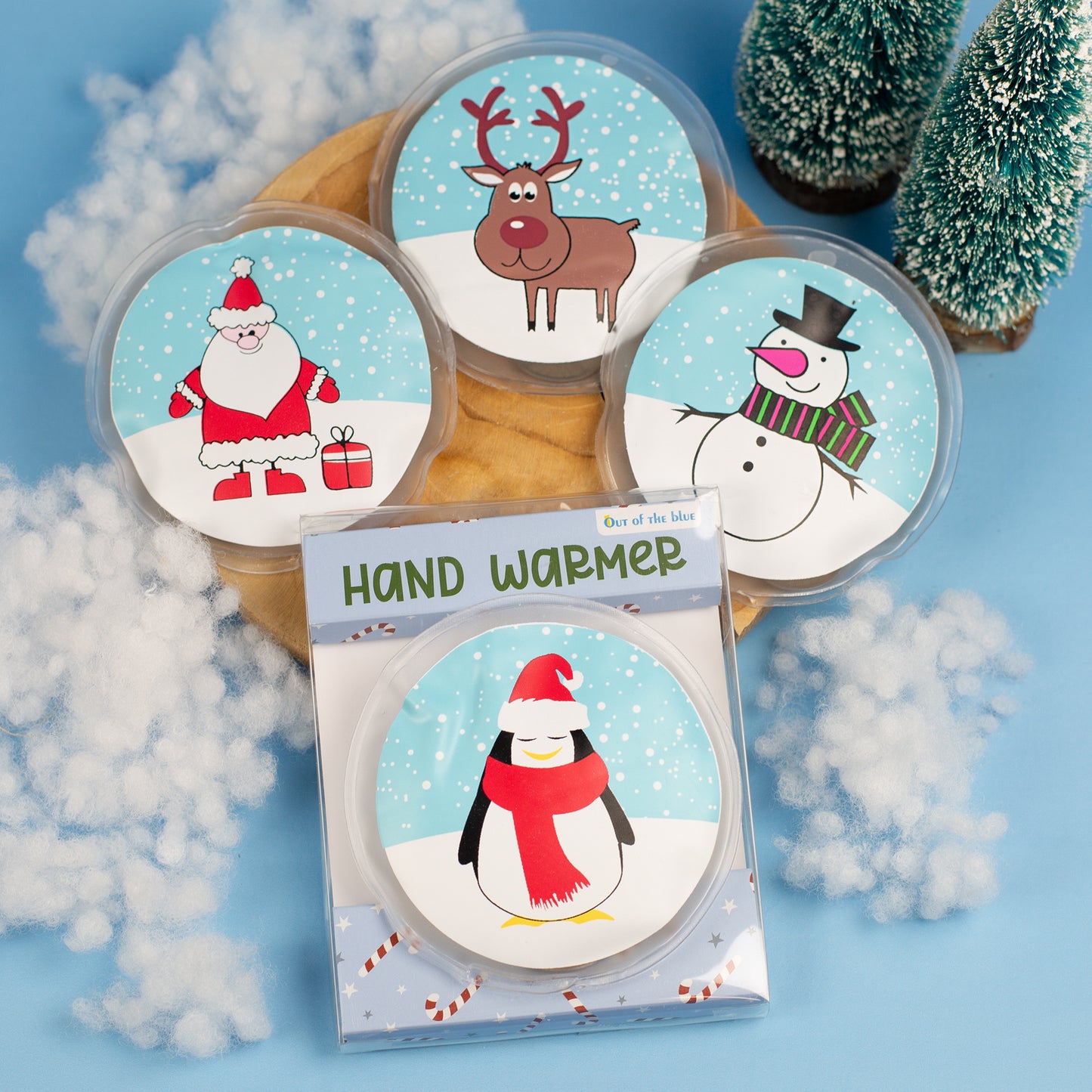 Handwärmer mit Pinguinmotiv in Geschenkverpackung, daneben weitere Motive