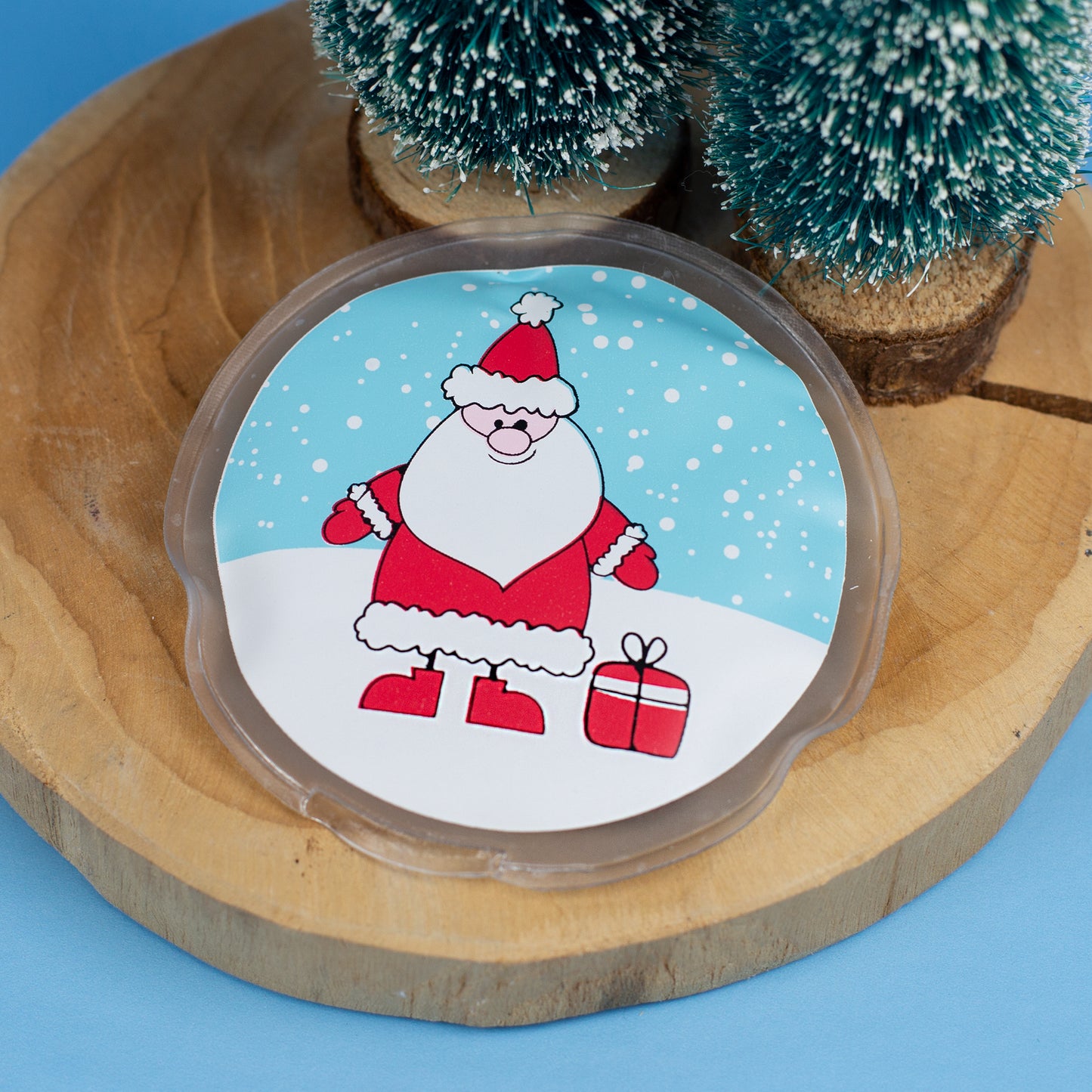 Runder Handwärmer mit Weihnachtsmann-Motiv und Deko-Tannen