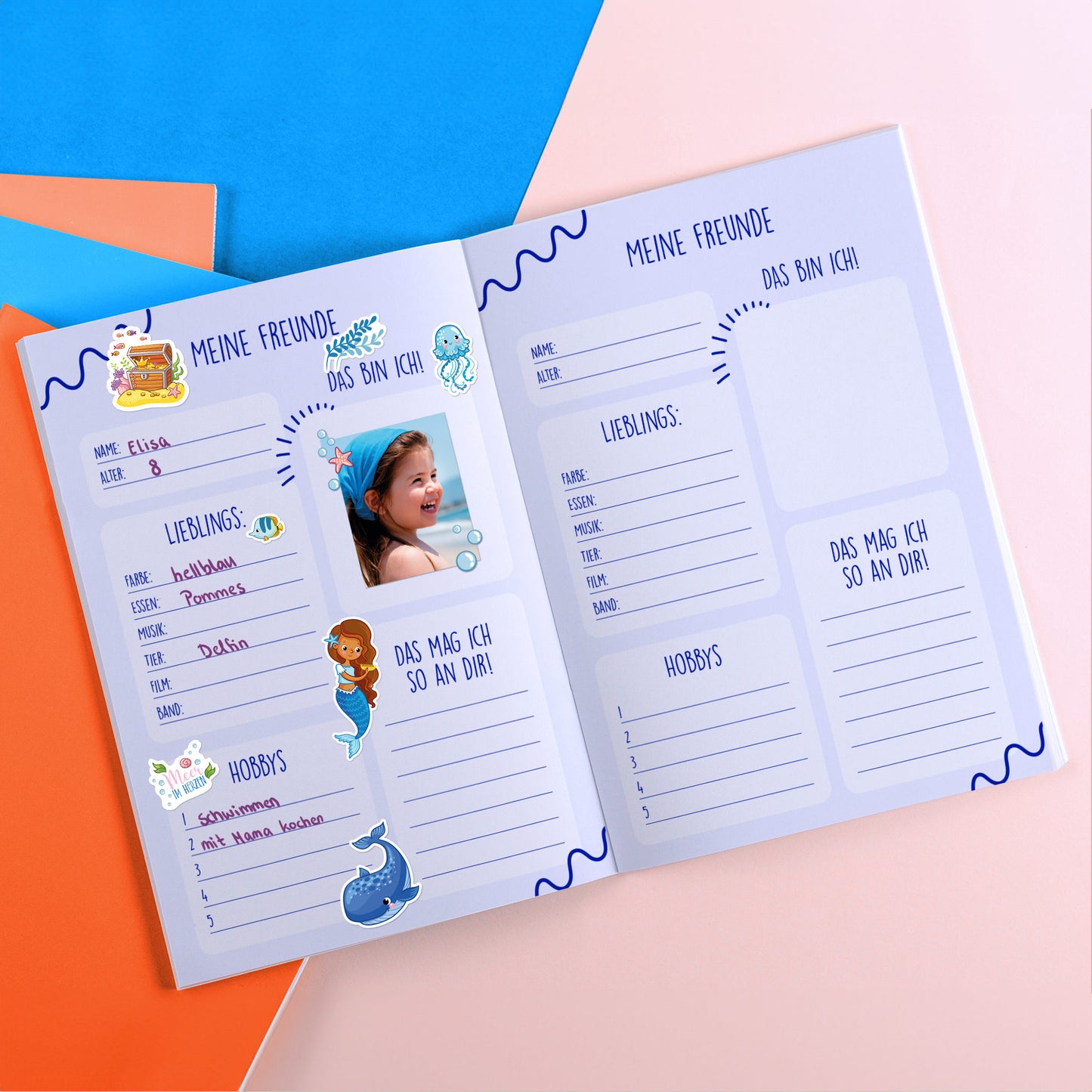 Freundebuch mit maritimen Stickern wie Schatztruhe, Delfin, Wal, Meerjungfrau