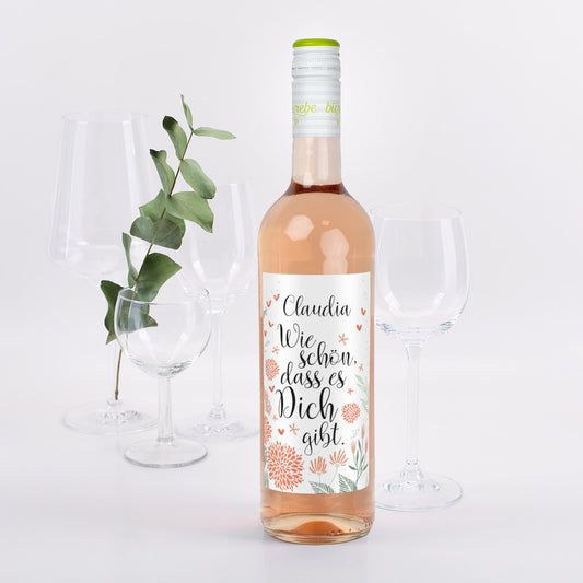 Weinflasche Rosé mit Floraldekor und Aufschrift „Wie schön, dass es Dich gibt“ – personalisiert mit Name