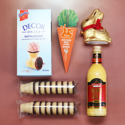 Oster Geschenkbox mit Eierlikör, Lindt Goldhase und Schokolade im Holzkorb mit Oster Motiv