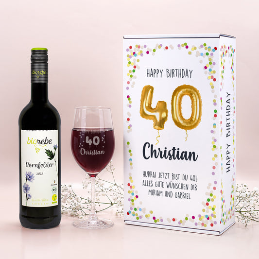 Geschenkset mit Biowein Dornfelder, graviertem Leonardo-Weinglas und Geburtstagsbox „Happy Birthday 40 Christian“ mit goldenen Luftballon-Zahlen und bunter Konfettoumrandung