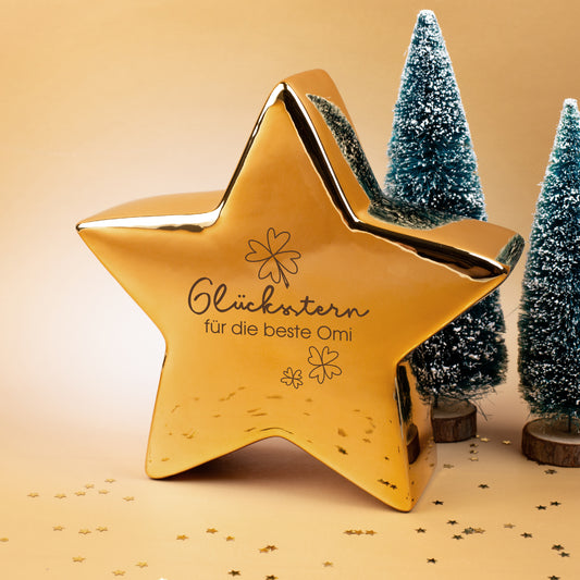 Goldener Leonardo Keramikstern mit Glücksstern-Aufdruck und Wunschtext, weihnachtlich dekoriert