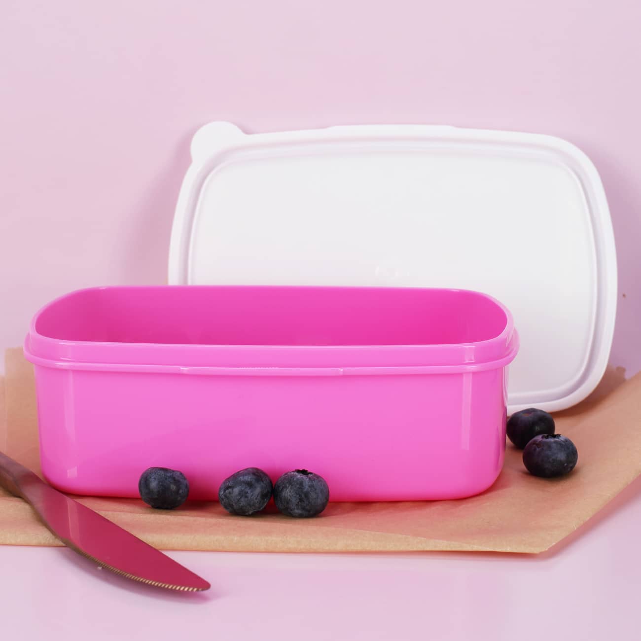 Rosa Brotdose mit weißem Deckel