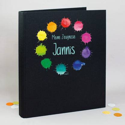 Zeugnismappe aus Leinen in Schwarz mit buntem Farbklekse-Motiv und Name Jannis bedruckt