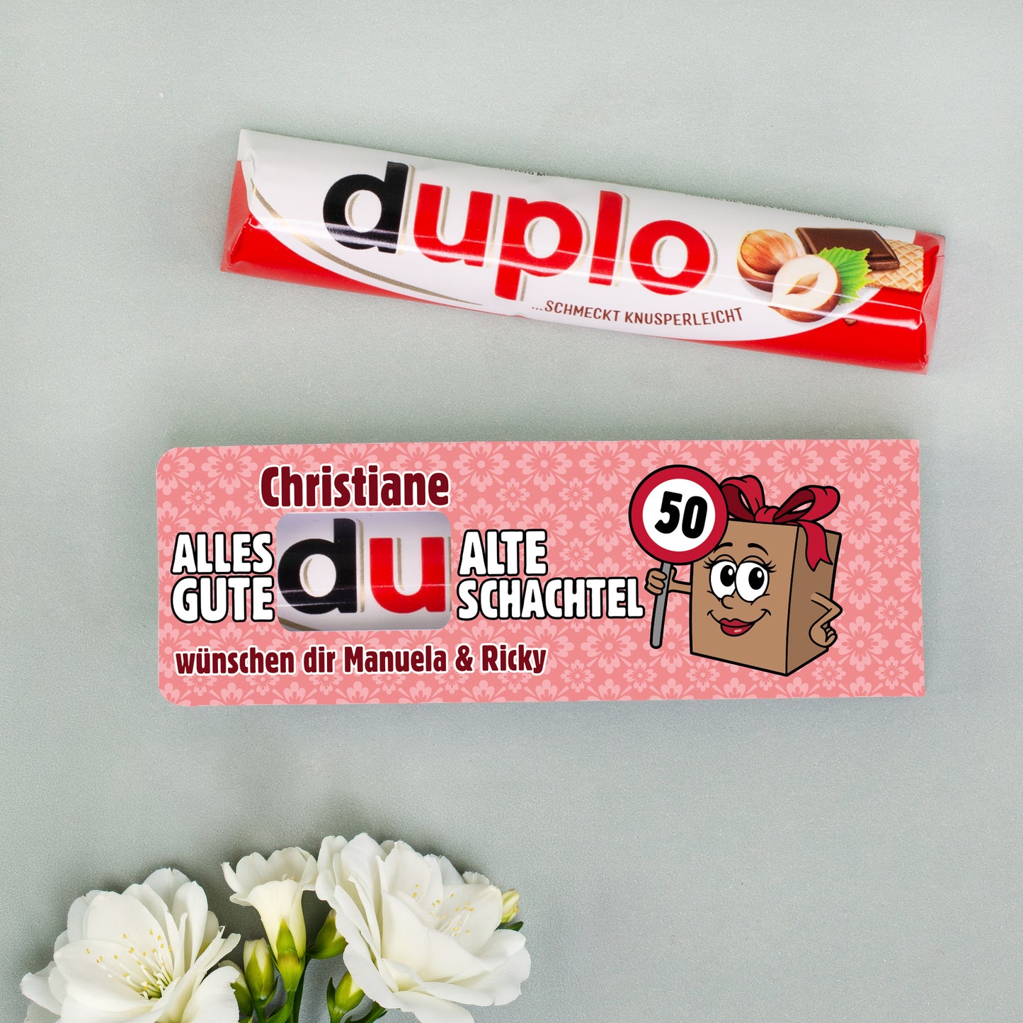 Original duplo Riegel neben personalisierter Alte Schachtel Banderole mit Name Christiane und Alter 50