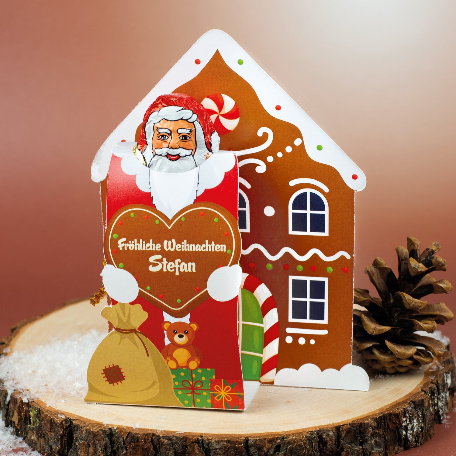 Lindt-Weihnachtsmann mit personalisierter Banderole mit Lebkuchenhaus