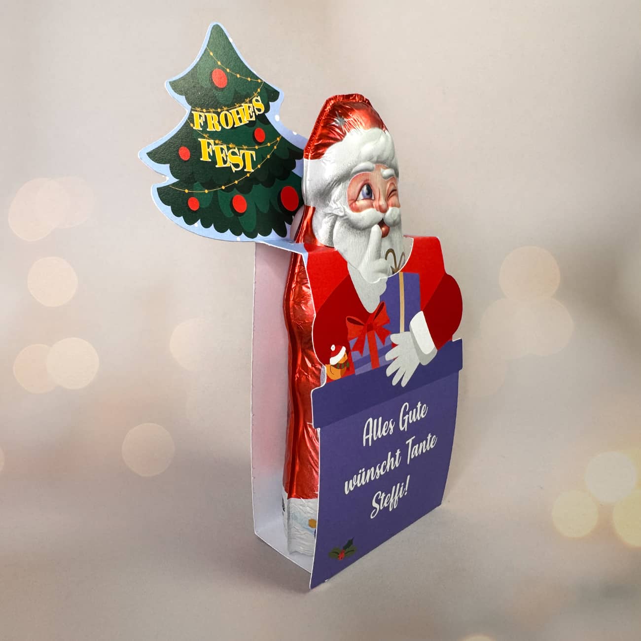 Milka Weihnachtsmann in Geschenkverpackung mit Ihrem Wunschtext - Frohes Fest