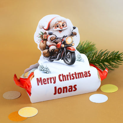 Personalisierter Mini-Stollen mit Geschenkverpackung „Merry Christmas Jonas“ und Weihnachtsmann auf rotem Motorrad