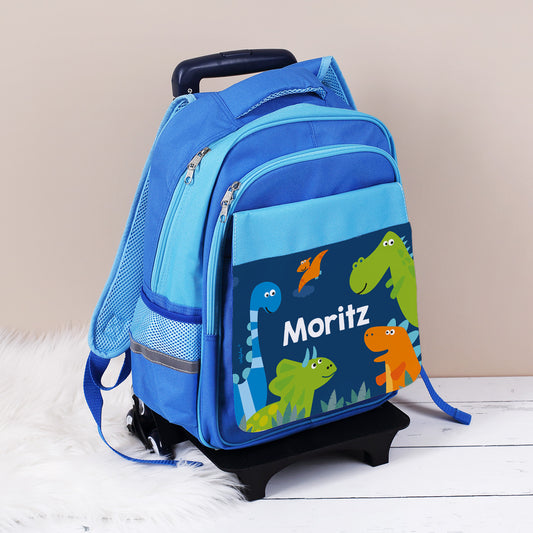 Kindertrolley mit Dino Motiv und Name bedruckt auf weißem Teppich